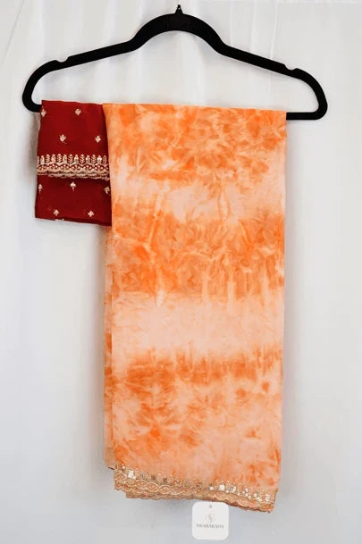 Peach Orange Marble Print Saree with Gold Sequin Lace Border and Maroon Embroidered Blouse
