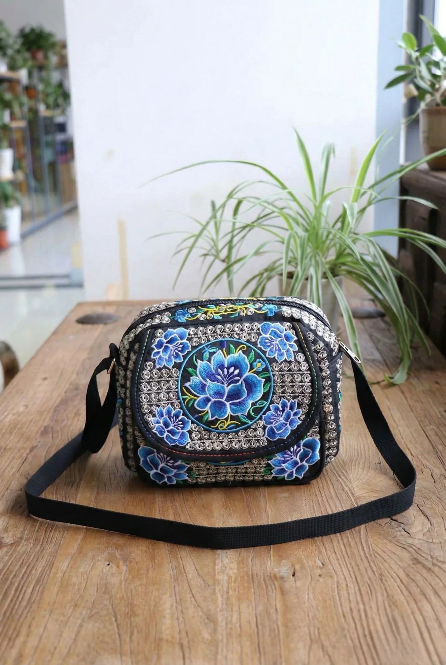 Black Sling Bag with Blue Floral Embroidery – Elegant Designer Handbag in the USA