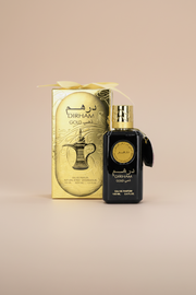 Dirham Gold Eau de Parfum bottle and packaging on a white background