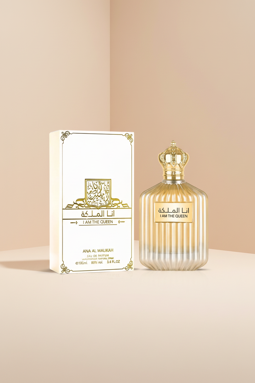 Perfume bottle and packaging of 'Ana Al Malikah' with gold accents on a white background