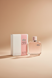 Lacoste L.12.12 Rose perfume bottle and packaging on a white background