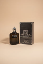 Perfume bottle and packaging of Ana Al Malik on a white background