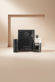 Gucci Guilty perfume set with bottle and packaging on a white background